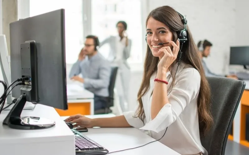 Smiling customer service representative wearing a headset