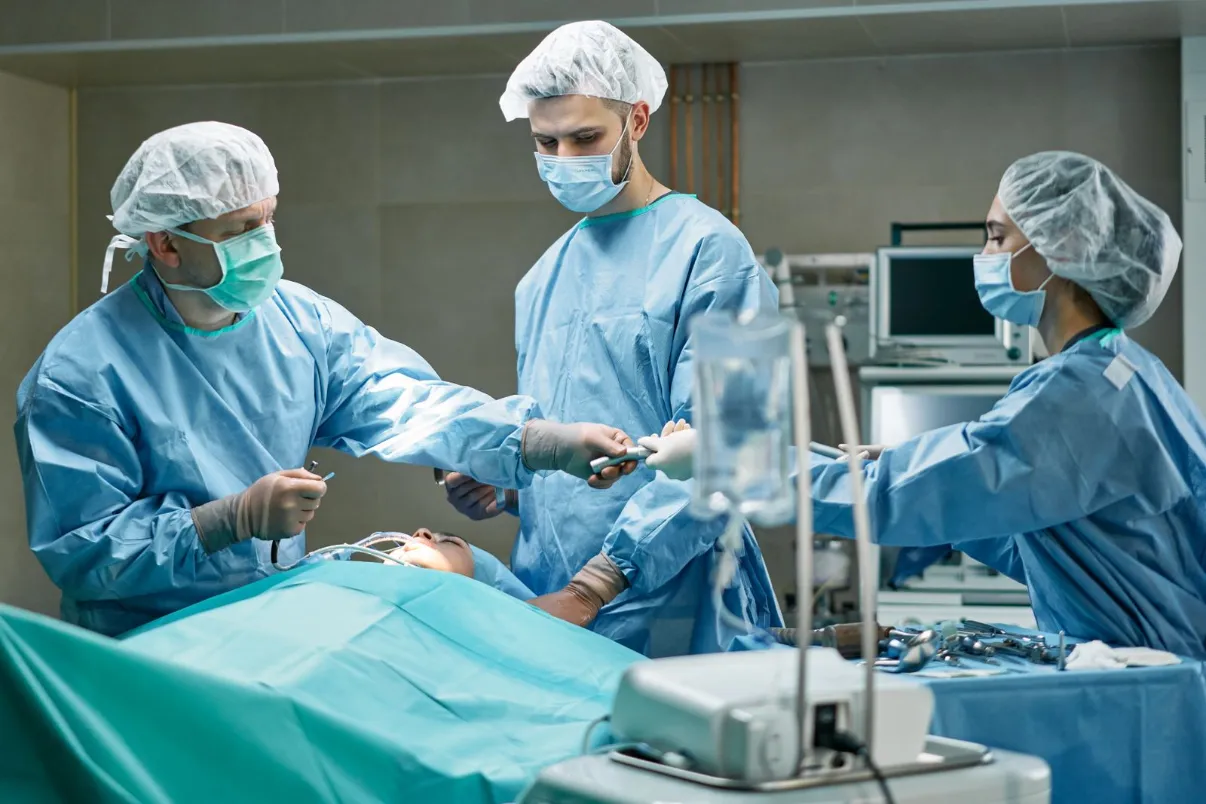 Surgical team performing a procedure in an operating room