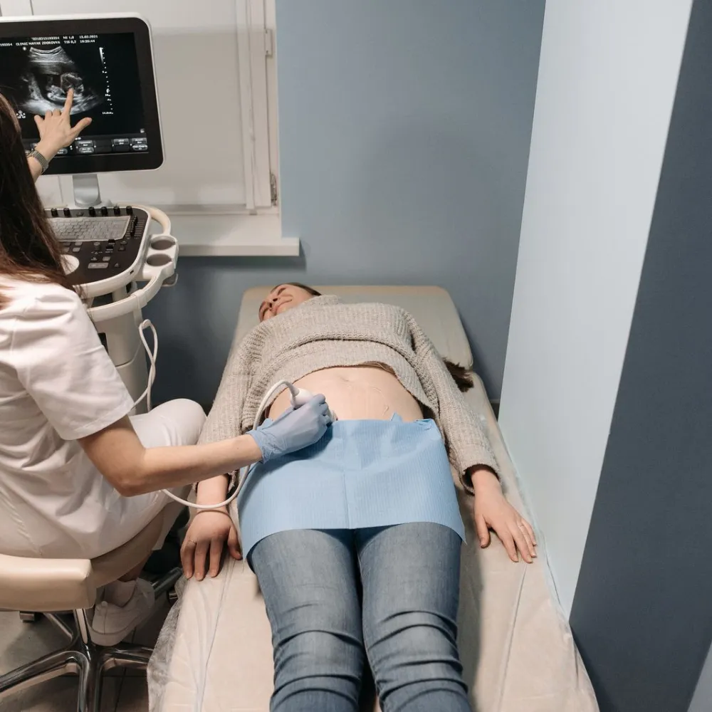 Clinician performing an abdominal ultrasound