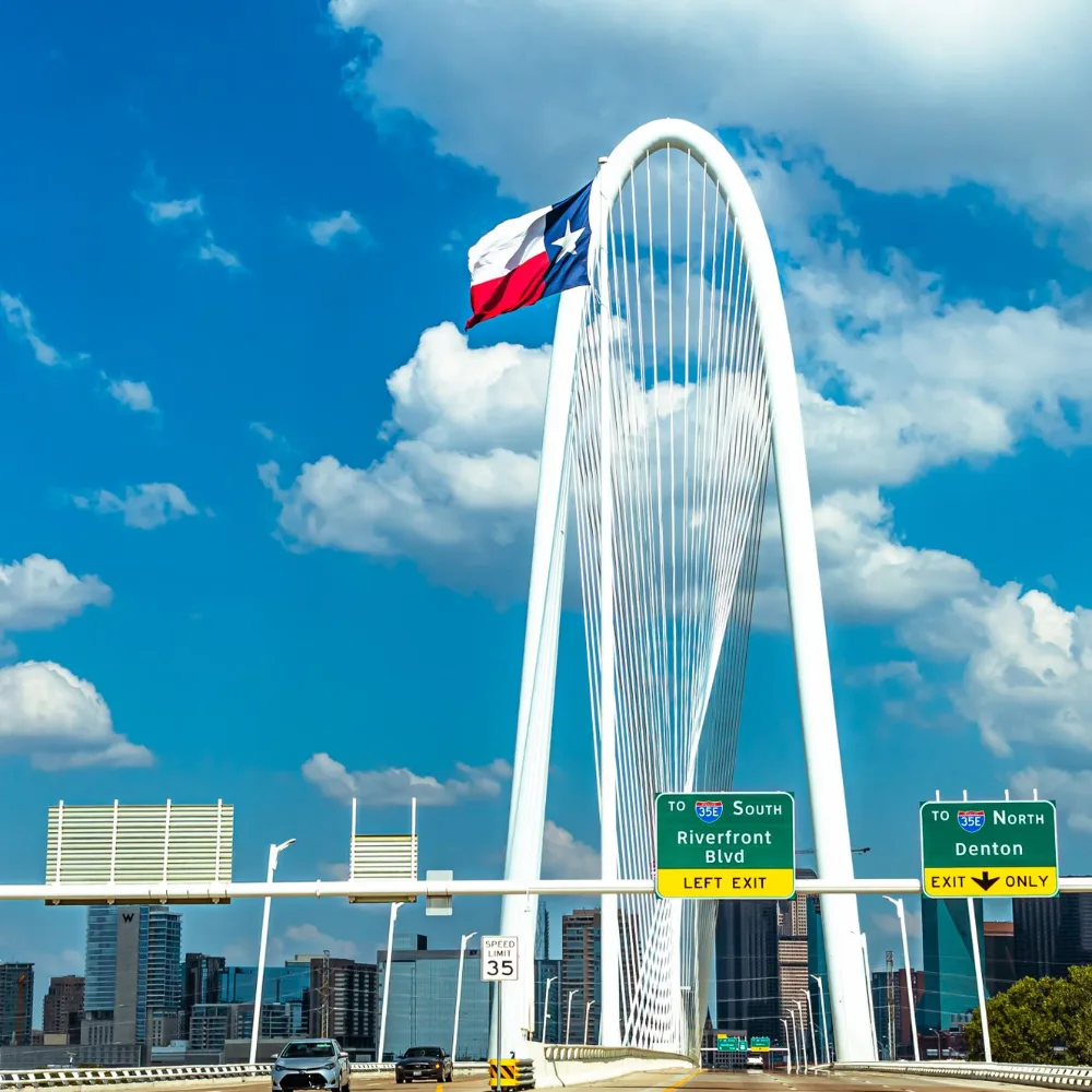 Margaret Hunt Hill Bridge in Dallas with the Texas flag